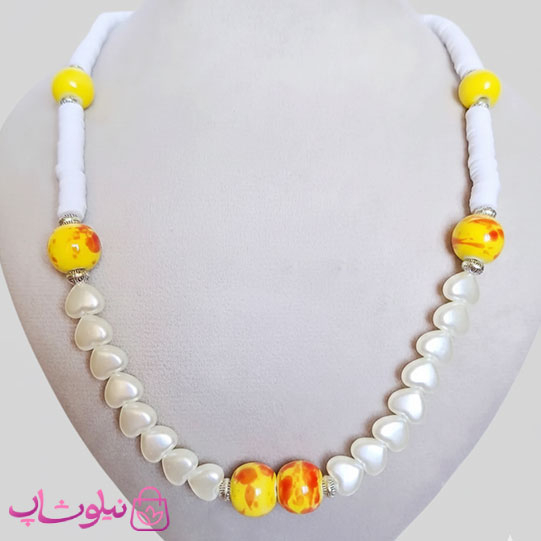 خرید  نیم ست دستساز برند N&SH مدل مروارید قلبی و فیمو و گوی چینی زرد 