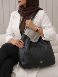 خرید  کیف دخترانه تک دسته طرح کوچ مشکی 