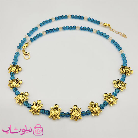 خرید  گردنبند زنانه دستساز برند N&SH مدل لاک پشتهای طلایی با کریستال سبزآبی 