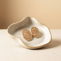 خرید گوشواره بیضی طرح سنگ ابروبادی با قاب طلایی